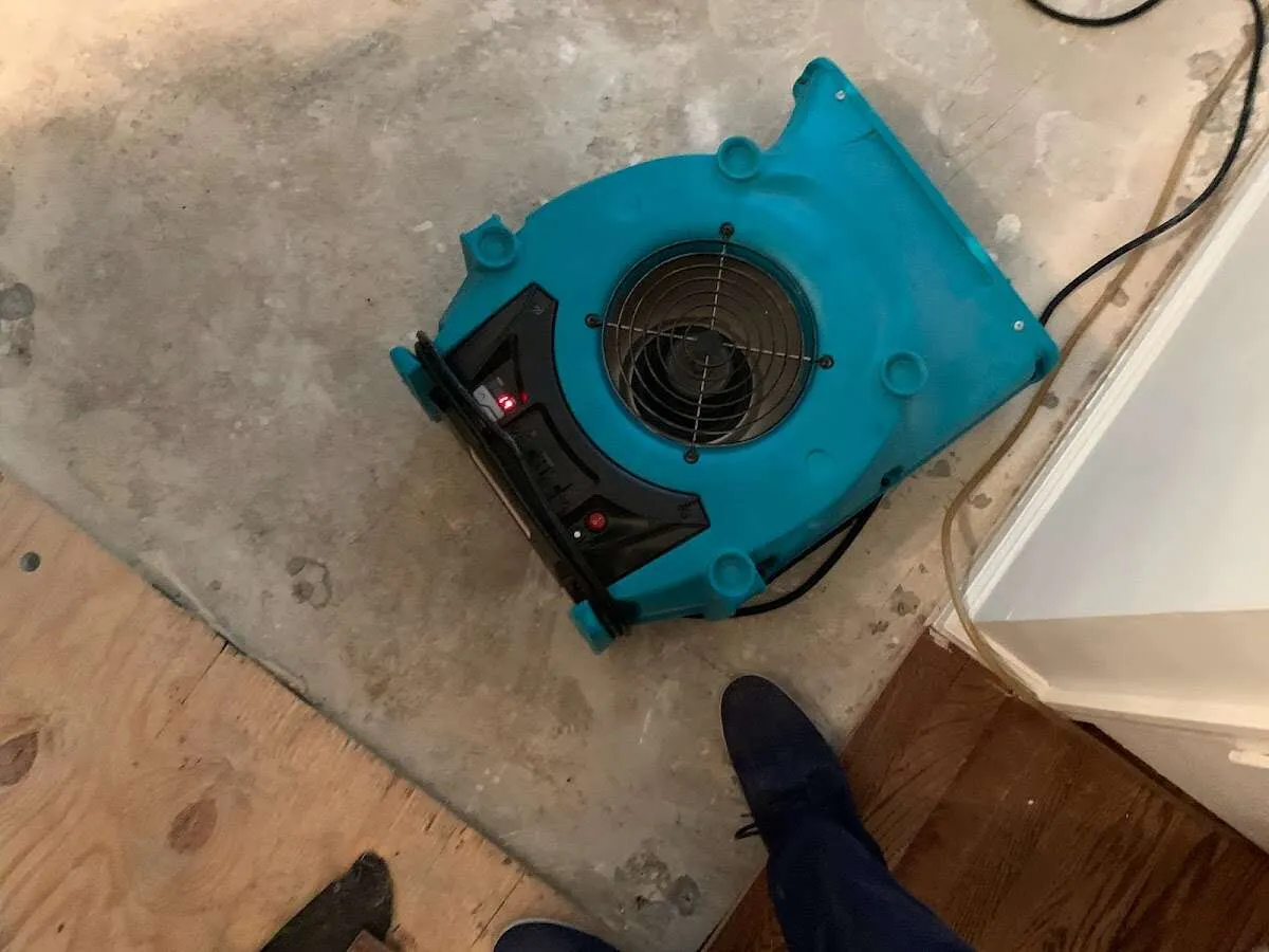 Air mover drying subfloor during Commercial Water Damage Restoration in Eastern Goleta Valley